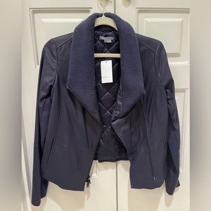 NWT Perfect condition. Small, navy blue. Purchased for $995. 100% goat leather.